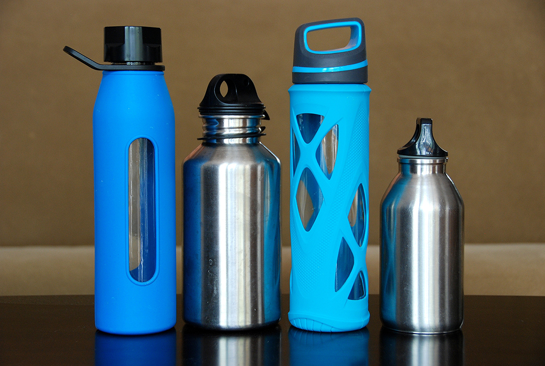 A line of reusable water bottles - From PickPik